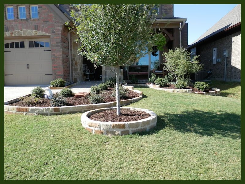 Custom brick and stone flower beds